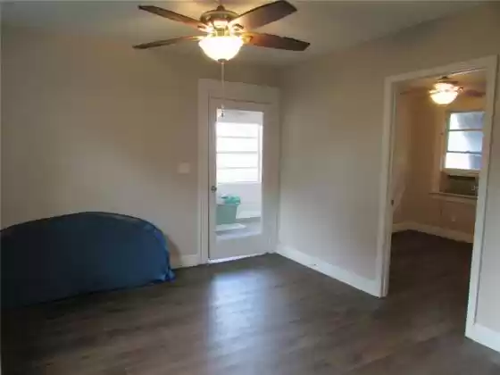View of Front Door from Living room.  2nd Bedroom shown on the right