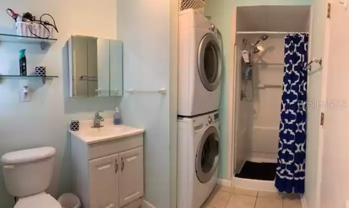 Master bathroom accommodates inside laundry as well