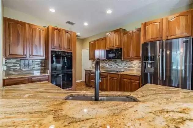 Look at that granite and ALL the cabinets!
