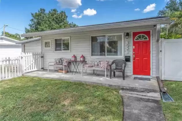 This front porch has been completely redone and look how cute! Looks out into your fenced front yard. Is this the perfect place to enjoy your morning cup of coffee?