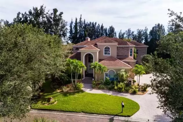 Luxury Estate Home In Gated Community with three car side entry Garage.
