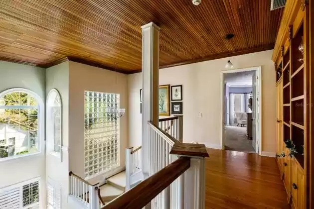 From the second floor landing, you see the perspective of the soaring ceilings in this home.