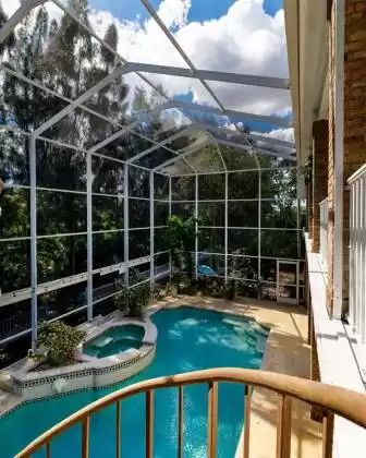 Spiral stair leads from master Balcony to the pool deck.