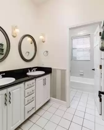 Full bath with double sinks & private toilet/shower area