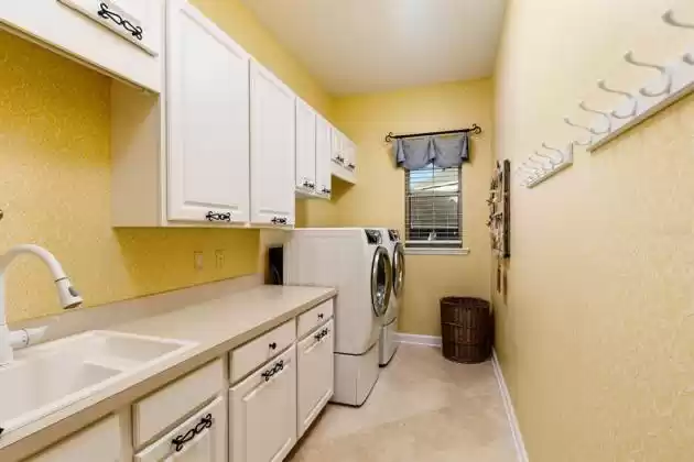 Even every-day features, such as the laundry room are spectacular. Large countertop for folding.